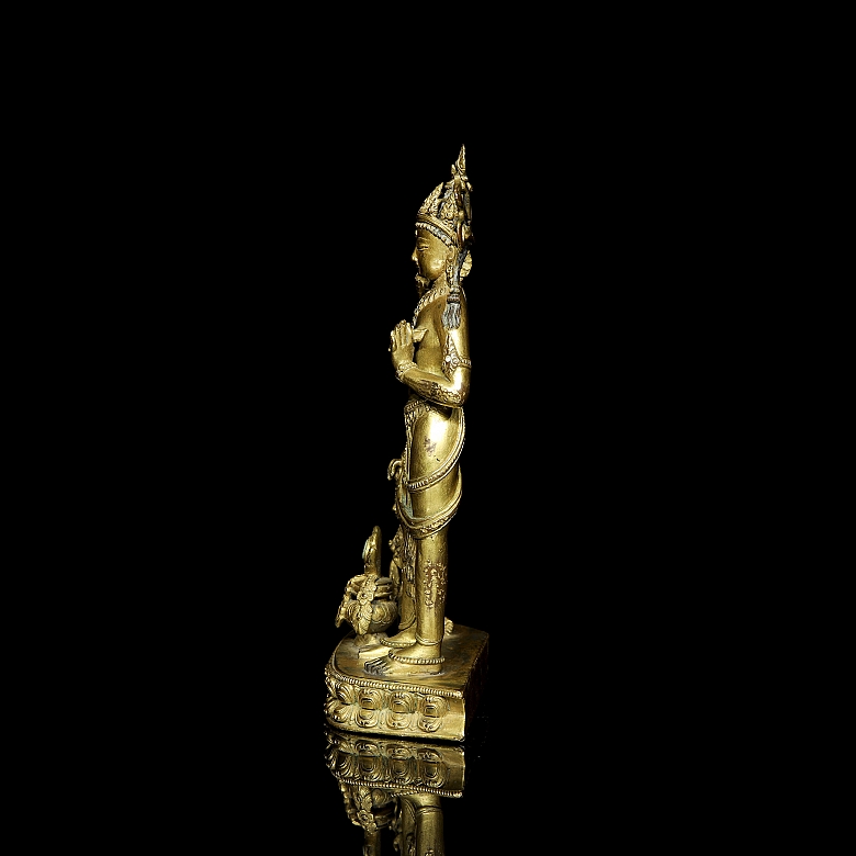 Grupo escultórico de bronce dorado 