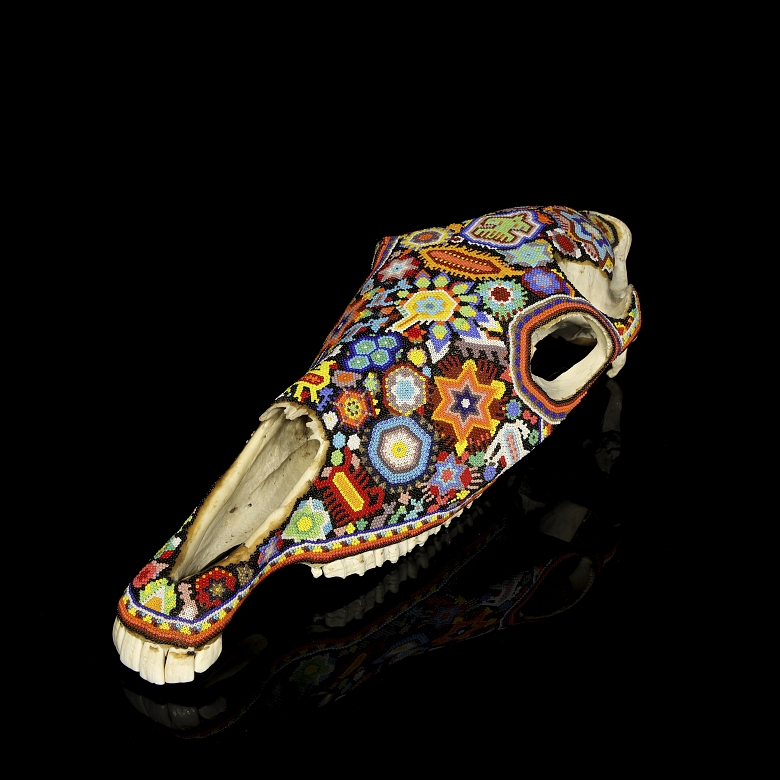 Skull decorated with beads, Huichol culture, Mexico, 20th century