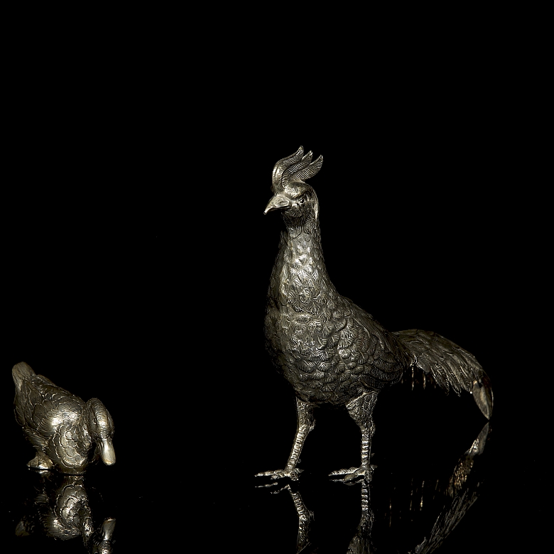 Dos figuras de plata 