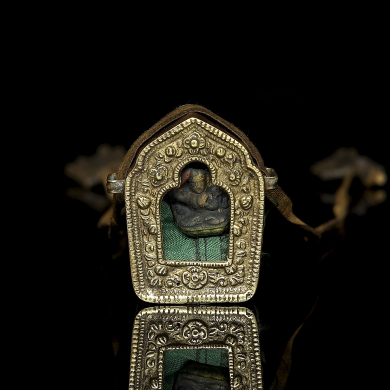Amuleto de bronce