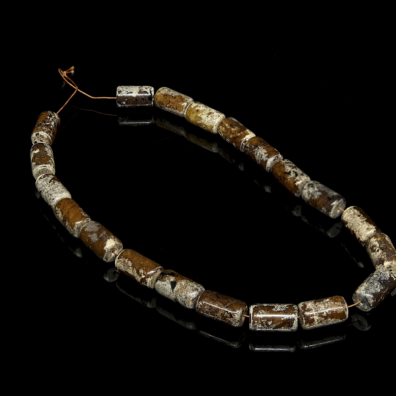 Necklace with twenty carved stone beads, Han style.