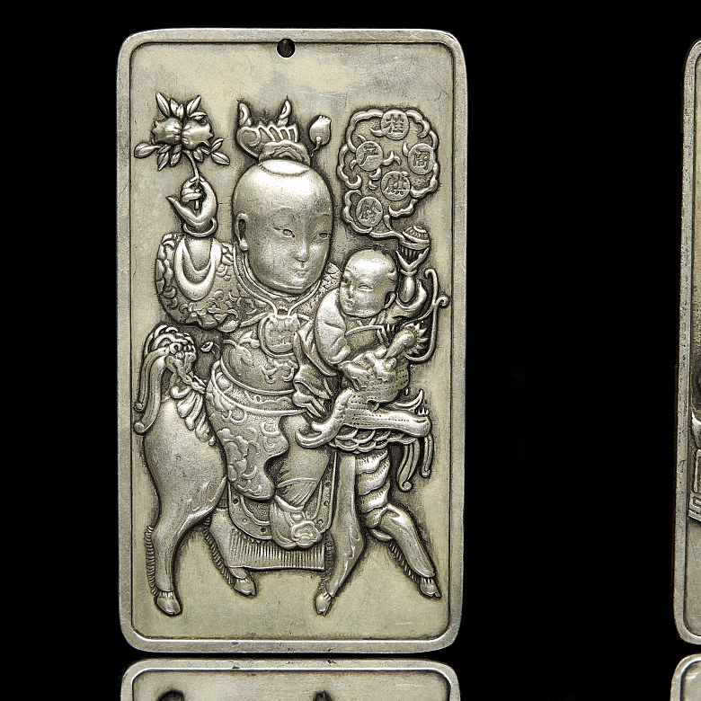 Pair of silver metal plaques, ‘Characters’, 20th century