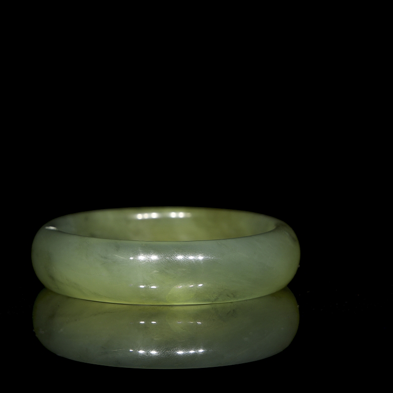 Circular carved jade bangle, 20th century
