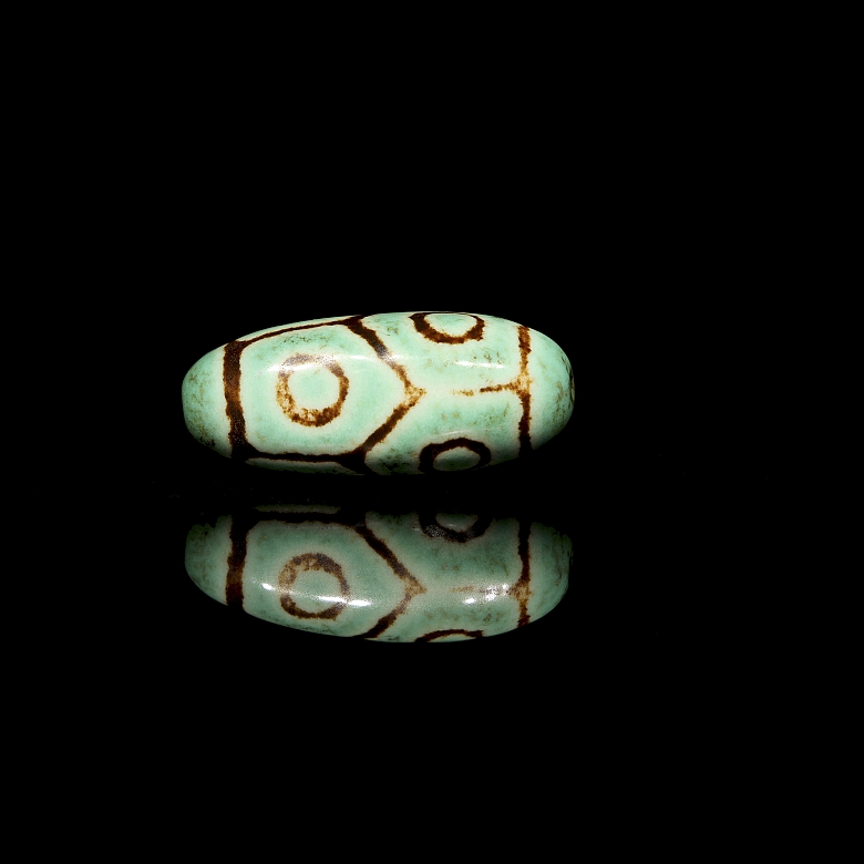 Cuenta Dzi de piedra tallada