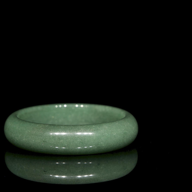 Rigid green jade bangle, 20th century