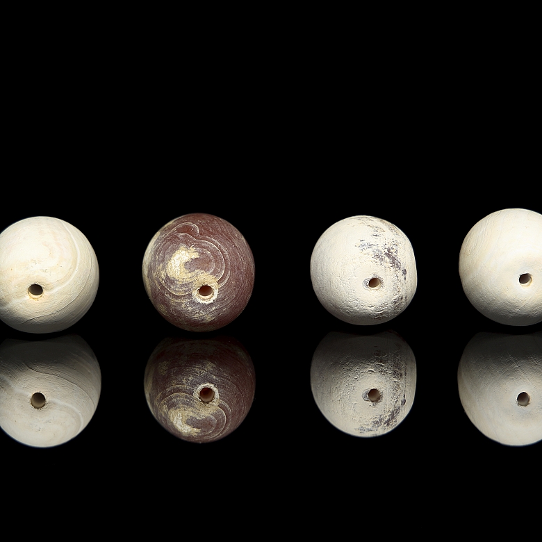 Four large carved stone beads, Qing dynasty