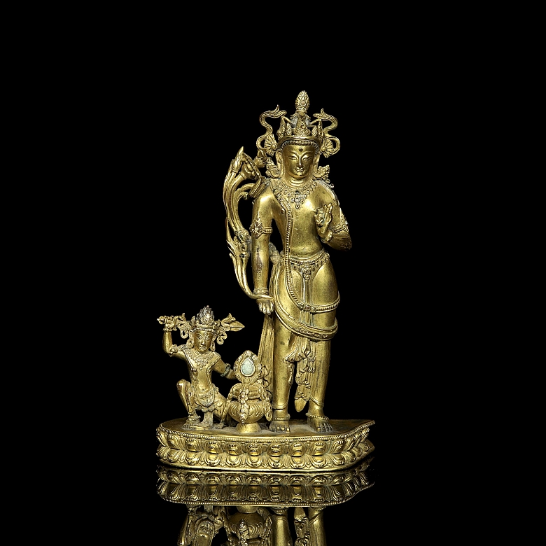 Grupo escultórico de bronce dorado 