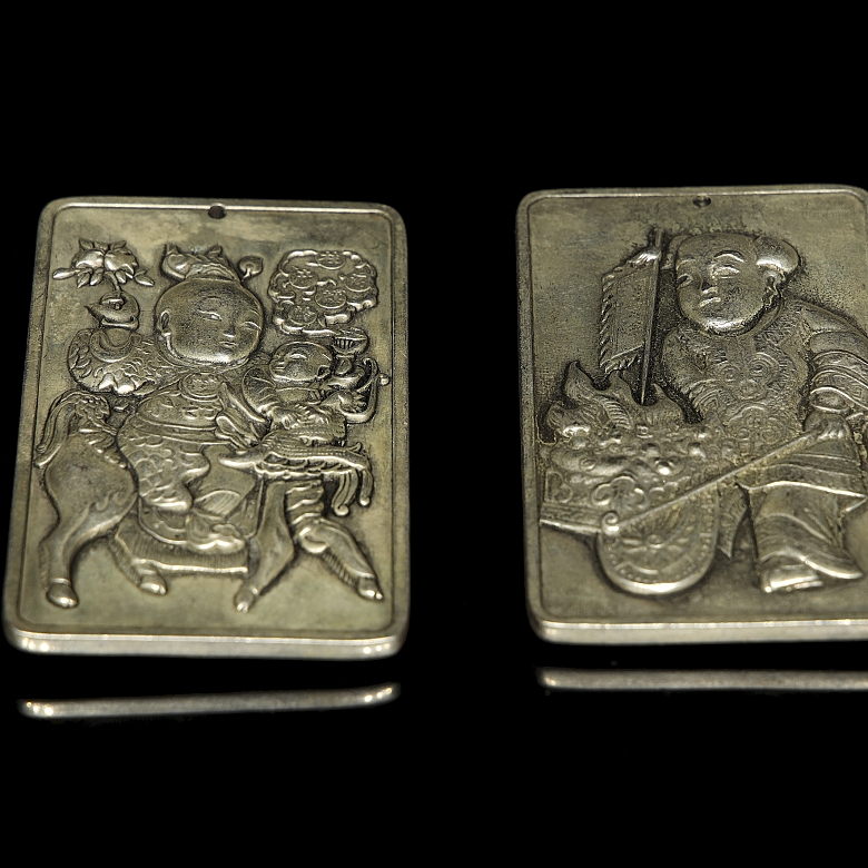 Pair of silver metal plaques, ‘Characters’, 20th century