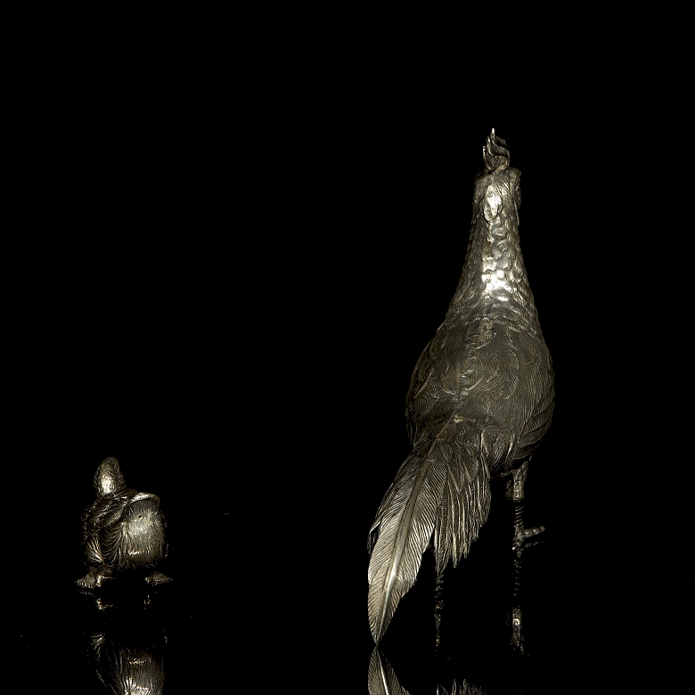 Dos figuras de plata 