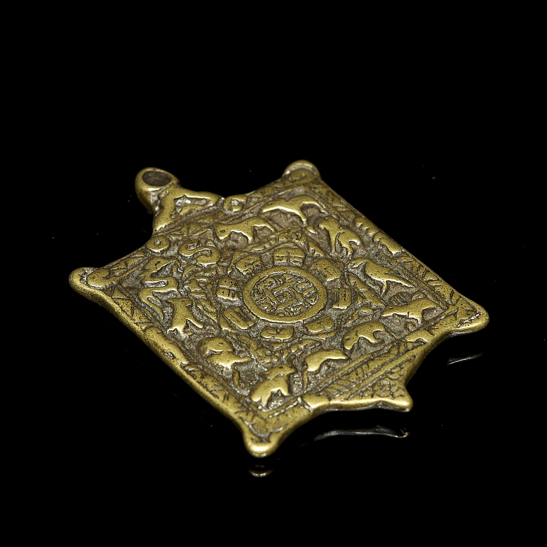 Amuleto de bronce