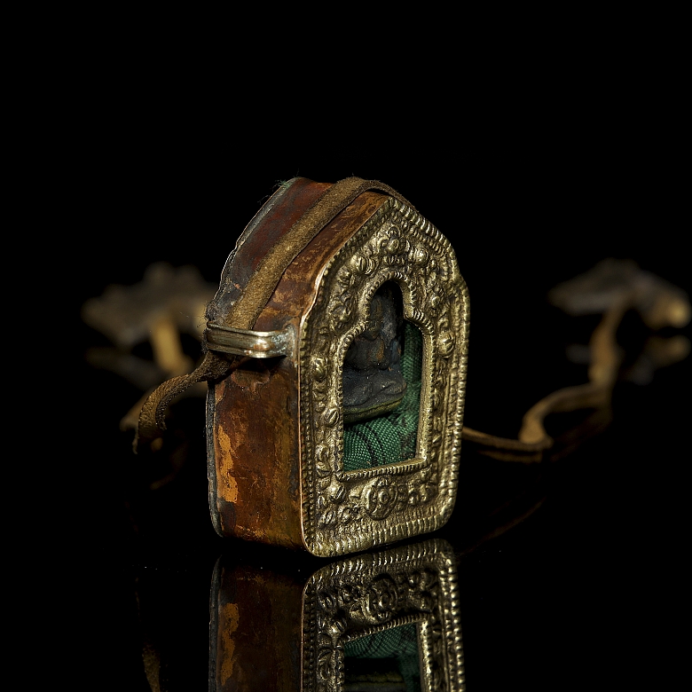 Amuleto de bronce