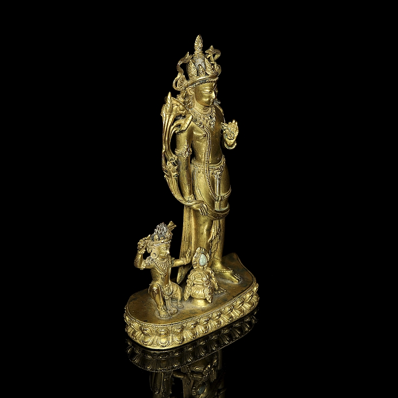 Grupo escultórico de bronce dorado 