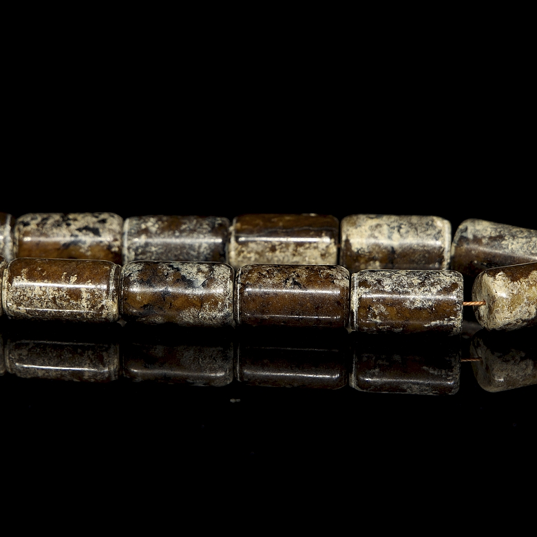 Necklace with twenty carved stone beads, Han style.