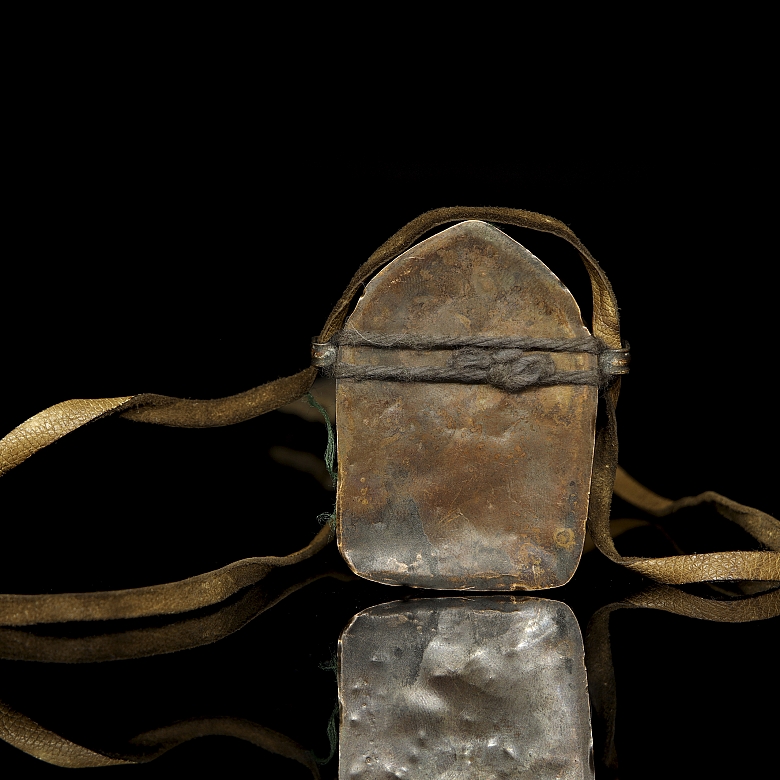 Amuleto de bronce
