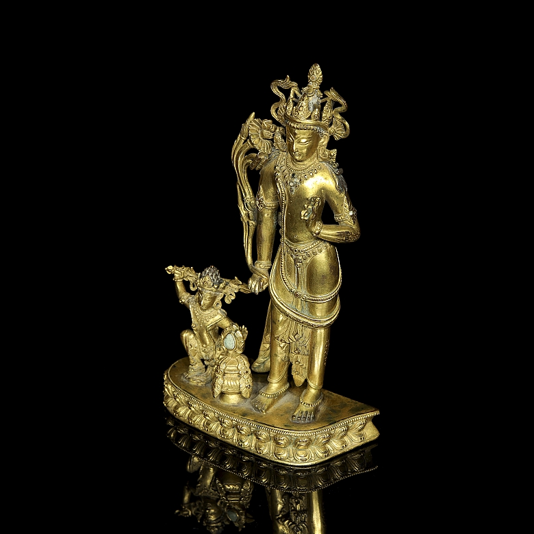 Grupo escultórico de bronce dorado 