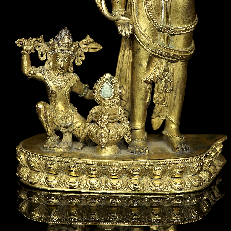 Grupo escultórico de bronce dorado 