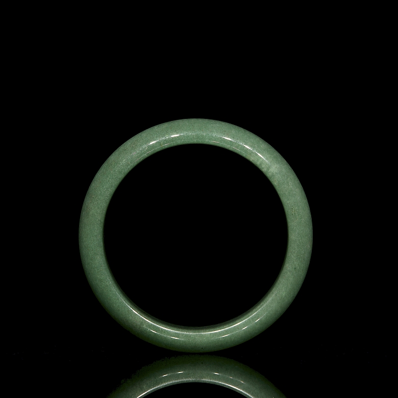 Rigid green jade bangle, 20th century